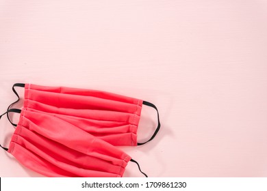 Homemade Face Masks For Coronavirus Outbreak On A Pink Background.