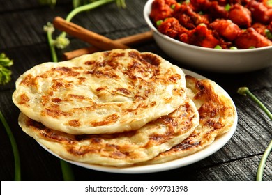 Homemade Famous Indian Bread Paratha With Meat Curry.