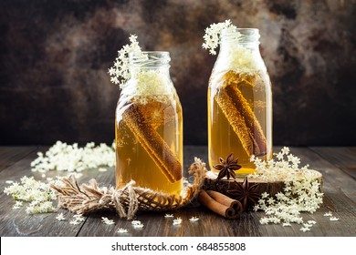 Homemade fermented cinnamon and ginger kombucha tea infused with elderflower. Healthy natural probiotic flavored drink. Copy space