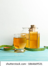 Homemade Fermented Kombucha Drink, In A Glass, Serving Bottle, Can Of Kombucha Mushroom And Centimeter Tape