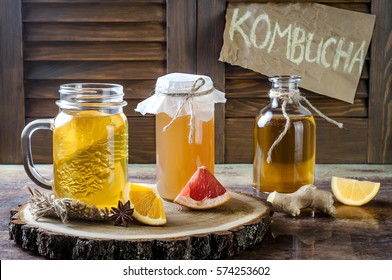 Homemade fermented raw kombucha tea with different flavorings. Healthy natural probiotic flavored drink. Copy space.