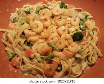 Homemade Fettucini Pasta In Alfredo Sauce, With Shrimps, Brocolli And Carrot