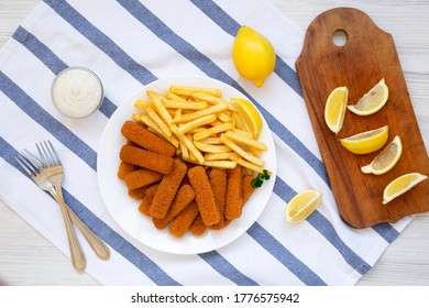 Homemade Fish Sticks And Fries With Tartar Sauce On A White Wooden Background, Top View. Flat Lay, Overhead, From Above. 