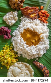 Homemade Fish Thali Meal Served At Bannana Leaf In Kerala State, India. Overhead View