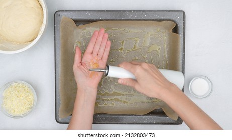 Homemade Flat Bread Recipe. Baking Tray With Parchment Paper And Olive Oil. Close Up Baking Process, View From Above