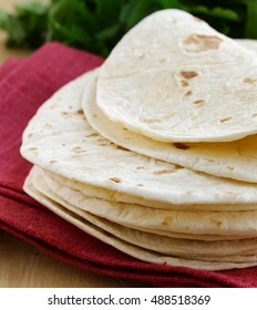 homemade flat cakes tortillas on wooden table