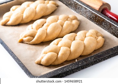 Homemade food concept process proved bread braid challah dough on white background with copy space - Powered by Shutterstock