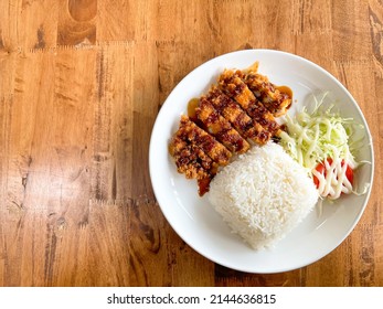 Homemade food, Fried pork cutlet and shredded cabbage salad with sauce. (Tonkatsu rice)
