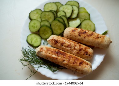 Homemade food. Grill chicken sausages with cucumbers. High quality photo - Powered by Shutterstock