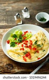 Homemade French Omelette With Capsicum And Herbs