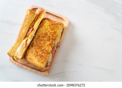 Homemade French toast ham bacon cheese sandwich with egg