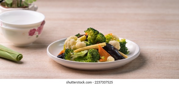 Homemade fresh boiled vegetables with cauliflower, broccoli, black fungus and baby corn, healthy eating lifestyle concept.