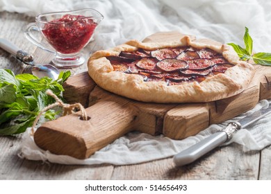 Homemade Fresh Figs Galette With Fig Jam On Wooden Table