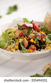 Homemade Fresh Organic Chicken Chipotle Black Bean Salad Bowl Angled View On White Wood