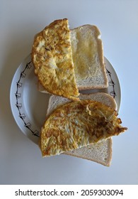 Homemade Freshly Caught Whitebait Fritter On A Slice Of Buttered Bread Plated Top View