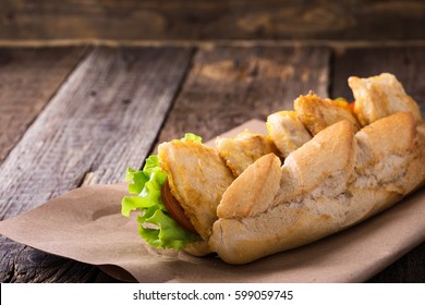 Homemade Fried Fish Sandwich. Fried Catfish Po Boy On Rustic Wooden Table 