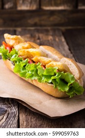 Homemade Fried Fish Sandwich. Fried Catfish Po Boy On Rustic Wooden Table 