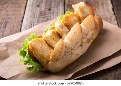 Homemade Fried Fish Sandwich. Fried Catfish Po Boy On Rustic Wooden Table 