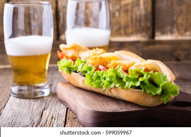 Homemade Fried Fish Sandwich. Fried Catfish Po Boy On Rustic Wooden Table 