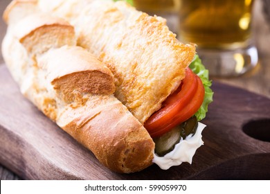 Homemade Fried Fish Sandwich. Fried Catfish Po Boy On Rustic Wooden Table 