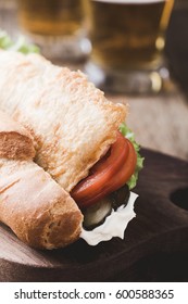 Homemade Fried Fish Sandwich. Fried Catfish Po Boy On Rustic Wooden Table 