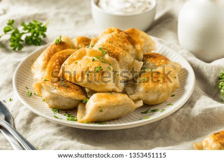Homemade Fried Polish Potato Pierogis with Sour Cream