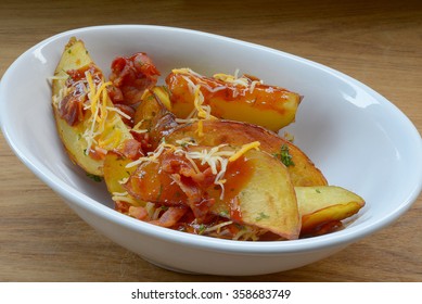 Homemade fried potato with spices and herbs 