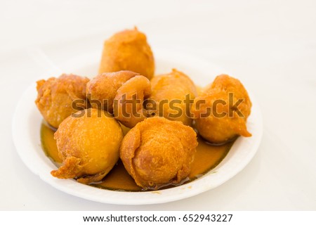 Homemade fritters with sugar and its ingredients, white background