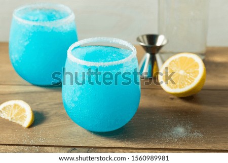 Homemade Frozen Blue Jack Frost Cocktail with Lemon and Vodka