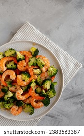 Homemade Garlic Broccoli Shrimp Stir Fry on a Plate, top view. Space for text.