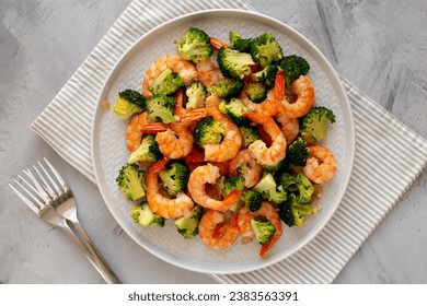 Homemade Garlic Broccoli Shrimp Stir Fry on a Plate, top view. Flat lay, overhead, from above.