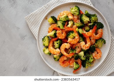 Homemade Garlic Broccoli Shrimp Stir Fry on a Plate, top view. Copy space. - Powered by Shutterstock