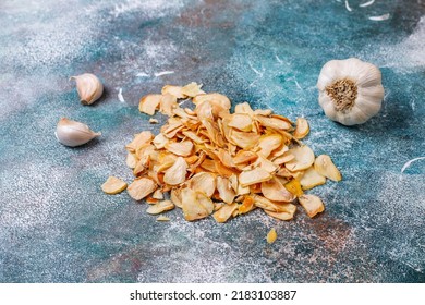 Homemade Garlic Flakes And Garlic Powder With Garlic Cloves.