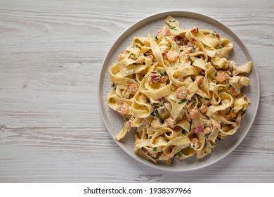 Homemade Garlic Shrimp Bacon Alfredo On A Plate, Top View. Flat Lay, Overhead, From Above. Copy Space.