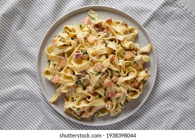 Homemade Garlic Shrimp Bacon Alfredo On A Plate, Top View. Flat Lay, Overhead, From Above. 