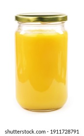  Homemade ghee (Sade yag) in jar and wooden spoon .   Ghee is purified butter.    isolated on white background.              