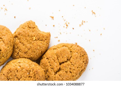 Homemade Ginger Biscuit With Peanuts And Raisins. Delicious Honey Sweetmeal Digestive Cookie On A Plate. On A White Background With Light Shadow. Detailed Closeup Studio Shot With Selective Focus.