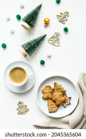 Homemade Gingerbread Cookies On A Plate And A Cup Of Coffee On A Christmas Table. Top View, Vertical. 