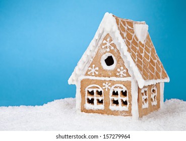 Homemade Gingerbread House On Blue Background 