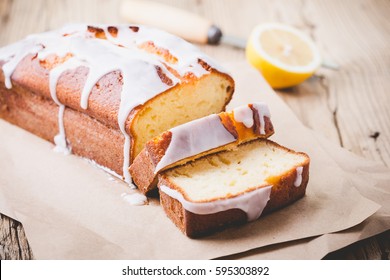 Homemade Glazed Lemon Pound Cake On Rustic Wooden Table, Sliced And Ready To Eat 