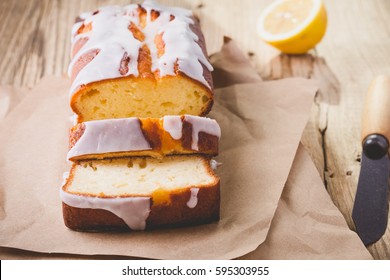 Homemade Glazed Lemon Pound Cake On Rustic Wooden Table, Sliced And Ready To Eat 