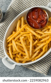 Homemade Golden French Fries with Tomato Ketchup and Salt