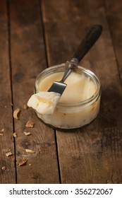 Homemade Goose Lard With Onion On A Knife. Selective Focus.