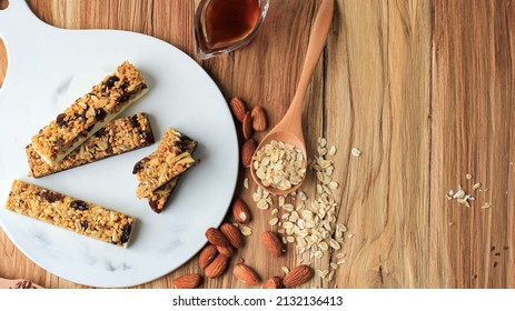 Homemade Granola Energy Bars With Figs, Oatmeal, Almond, Dry Cranberry, Chia And Sunflower Seeds, Healthy Snack, Top View, Copy Space