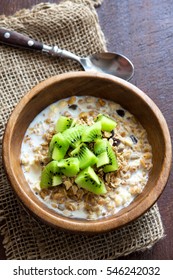 Homemade granola with milk and kiwi fruit for healthy breakfast