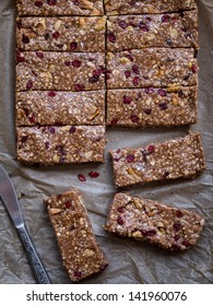 Homemade Granola Protein Bars With Peanut Butter, Honey, Nuts And Cranberries.