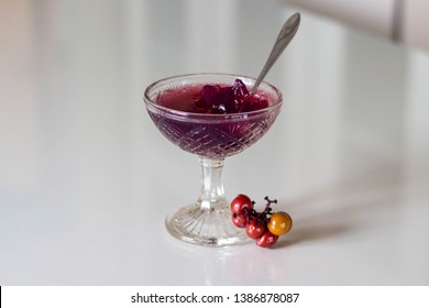 Homemade Grape Gelatin jelly Dessert in a Bowl. natural berry dessert for kids and adults. On white glass table.