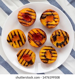 Homemade Grilled Peaches On A White Plate, Overhead View. Flat Lay, Top View, From Above.