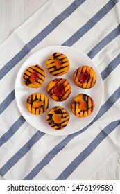 Homemade Grilled Peaches On A White Plate, Overhead View. Flat Lay, Top View, From Above.