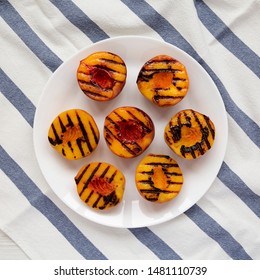 Homemade Grilled Peaches On A White Plate, View From Above. Flat Lay, Top View, Overhead.